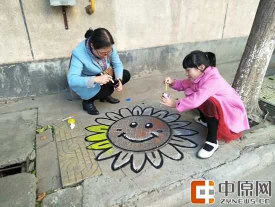 金水区花园路街道组织志愿者举办创意涂鸦美化